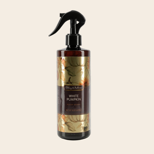 A 16 oz spray bottle of Alling & Scott's White Pumpkin Room Spray, featuring a black trigger sprayer and a label with a gold and brown pumpkin leaf pattern, set against a plain white background.